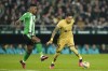 Barcelona's Raphinha, right, is challenged by Betis' Abner santos during a Spanish La Liga soccer match between Real Betis and Barcelona at the Benito Villamarin stadium in Seville, Spain, Wednesday, Feb. 1, 2023. (AP Photo/Jose Breton)