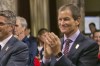 FILE- Gene Sykes claps after City Council voted 12-0 to endorse documents at the heart of its plan to stage the Summer Olympics for the third time since 1932, in Los Angeles on Aug. 11, 2017. The new leader of the U.S. Olympic and Paralympic Committee has reiterated the federation’s support for exploring a way for Russian athletes to compete at the Paris Olympics as neutrals. (AP Photo/Damian Dovarganes, File)