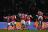 Reims' Folarin Balogun celebrates with teammates after scoring his side's opening goal during the French League One soccer match between Paris Saint-Germain and Reims at the Parc des Princes in Paris, Sunday, Jan. 29, 2023. (AP Photo/Thibault Camus)