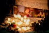 A vigil with photos of Morgan Harris is shown as family and friends of three murdered women gather in Winnipeg on Thursday, Dec. 1, 2022. Family members have said the women were vulnerable, and experienced periods of homelessness and addictions. THE CANADIAN PRESS/John Woods