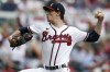 FILE - Atlanta Braves starting pitcher Max Fried (54) throws during the second inning in Game 1 of a National League Division Series baseball game against the Philadelphia Phillies on Oct. 11, 2022, in Atlanta. The pitcher went to salary arbitration with the Braves for the second straight year, asking for $15 million instead of the team’s $13.5 million offer. (AP Photo/John Bazemore, File)