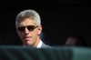 FILE - Baltimore Orioles general manager Mike Elias looks on from the dugout during ceremonies before a baseball game against he Pittsburgh Pirates, on Aug 6, 2022, in Baltimore. Elias is happy to accept some of the blame if expectations are a little harder to manage this season. The Orioles went 83-79 last year, a 31-win improvement that nearly landed Baltimore in the playoffs. (AP Photo/Terrance Williams)