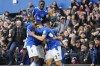 Everton's James Tarkowski, centre, celebrates with teammates after scoring his side's opening goal during the English Premier League soccer match between Everton and Arsenal at Goodison Park in Liverpool, England, Saturday, Feb. 4, 2023. (AP Photo/Jon Super)