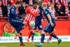 Berlin's Sheraldo Becker, center, fights for the ball against Stefan Bell, left, and Andreas Hanche-Olsen of Mainz during the German Bundesliga soccer match between Union Berlin and FSV Mainz 05 in Berlin, Germany, Saturday, Feb.4, 2023. (Andreas Gora/dpa via AP)