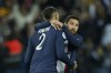 PSG's Lionel Messi, right, reacts with PSG's Achraf Hakimi during the French League One soccer match between Paris Saint-Germain and Toulouse, at the Parc des Princes, in Paris, France, Saturday, Feb. 4, 2023. (AP Photo/Lewis Joly)