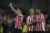 Brentford's Christian Norgaard, Ben Mee and Zanka, from left to right, celebrate at the end of the English Premier League soccer match between Brentford and Southampton at Brentford Community Stadium in London, Saturday, Feb. 4, 2023. Brentford won 3-0. (AP Photo/Kin Cheung)
