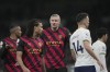 Manchester City's Erling Haaland, centre, speaks with Nathan Ake, 2nd left during an English Premier League soccer match between Tottenham Hotspur and Manchester City at the Tottenham Hotspur Stadium in London, Sunday, Feb. 5, 2023. (AP Photo/Kin Cheung)