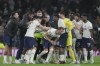 Tottenham players celebrate with goal scorer Harry Kane, centre, after they defeated Manchester City 1-0 during an English Premier League soccer match at the Tottenham Hotspur Stadium in London, Sunday, Feb. 5, 2023. (AP Photo/Kin Cheung)