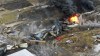 This photo taken with a drone shows portions of a Norfolk and Southern freight train that derailed Friday night in East Palestine, Ohio are still on fire at mid-day Saturday, Feb. 4, 2023. (AP Photo/Gene J. Puskar)