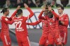 Bayern players celebrate after Kingsley Coman, third from right, scored his side's second goal during the German Bundesliga soccer match between VfL Wolfsburg and FC Bayern Munich in Wolfsburg, Germany, Sunday, Feb. 5, 2023. (AP Photo/Michael Sohn)