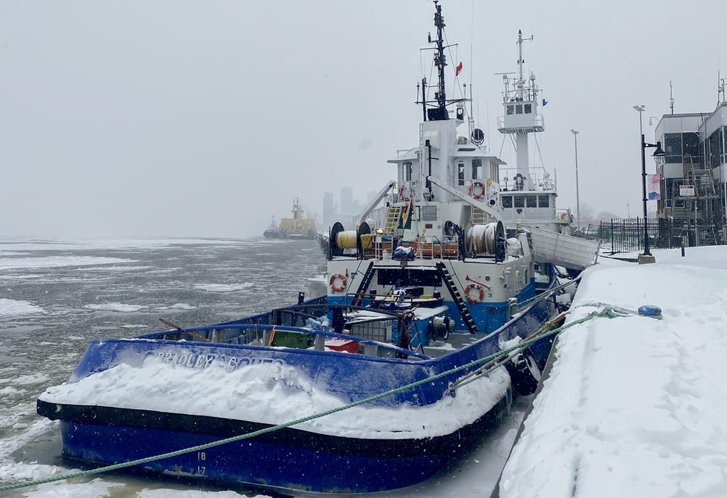 Two tugboats that have been detained by Transport Canada are shown in Trois-Rivières, Que. on Thursday, Feb. 2, 2023. Groups that advocate for seafarers are expressing concern for crew members who are spending a harsh Quebec winter aboard three tugboats that have been stuck in the port of Trois-Rivières for months. THE CANADIAN PRESS/Morgan Lowrie