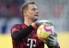 FILE - Bayern's goalkeeper Manuel Neuer holds the ball prior to the German Bundesliga soccer match between Hertha BSC Berlin and FC Bayern Munich in Berlin, Germany, Saturday, Nov. 5, 2022. Bayern Munich CEO Oliver Kahn, sporting director Hasan Salihamidzic and team coach Julian Nagelsmann have all criticized injured captain Manuel Neuer for publicly expressing his disappointment with the club. (AP Photo/Michael Sohn, File)