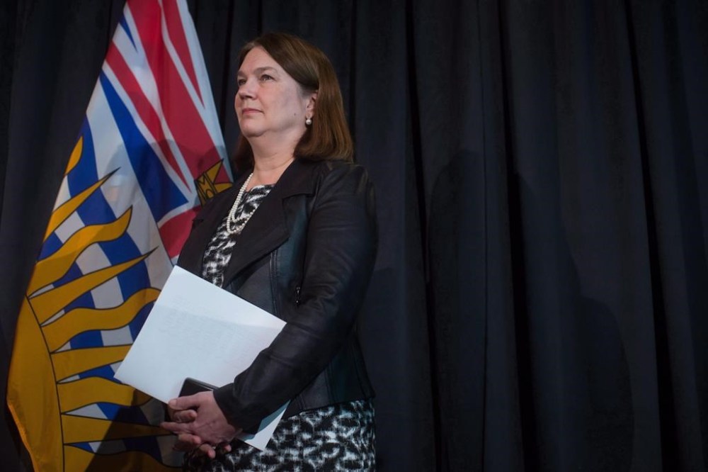 Federal Health Minister Jane Philpott listens after she and British Columbia Health Minister Terry Lake announced the province and the federal government had reached an agreement on health care funding, during a news conference in Richmond, B.C., on Friday February 17, 2017. Former health minister Philpott says the targeted funding agreements Ottawa signed with the provinces six years ago have not provided the
