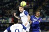 Lazio's Ciro Immobile heads the ball past Verona's Isak Hien, right, during the Serie A soccer match between Hellas Verona and Lazio at the Marcantonio Bentegodi stadium in Verona, Italy, Monday, Feb. 6, 2023. (Paola Garbuio/LaPresse via AP)