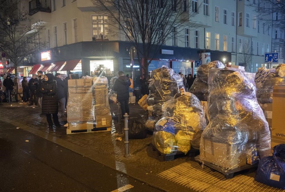 Relief supplies for earthquake victims in Turkey and Syria stand packed on Turmstrasse in Moabit, Berlin, Germany, Monday, Feb. 6, 2023. Members of the Turkish community in Berlin collected tons of relief supplies within a few hours. The police closed Turmstrsse so that the volunteers could load numerous trucks. (Paul Zinken/dpa via AP)