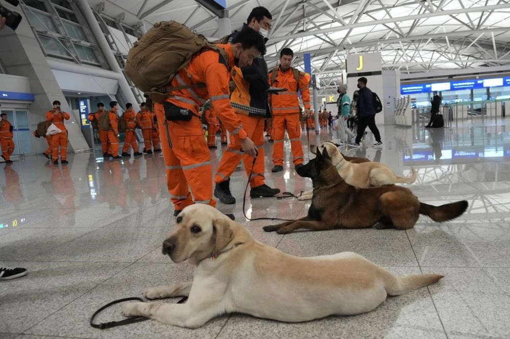South Korean rescue team members arrive to board a plane to leave for quake-ravaged Turkey at the Incheon International Airport in Incheon, South Korea, Tuesday, Feb. 7, 2023. (AP Photo/(AP Photo/Ahn Young-joon)