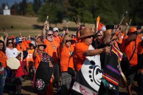 Drummers raise their arms as they sing and drum to begin a ceremony to mark the National Day for Truth and Reconciliation, at the site of the former St. Mary's Indian Residential School in Mission, B.C., on Friday, September 30, 2022. British Columbia has introduced legislation to make the National Day for Truth and Reconciliation a statutory holiday. THE CANADIAN PRESS/Darryl Dyck