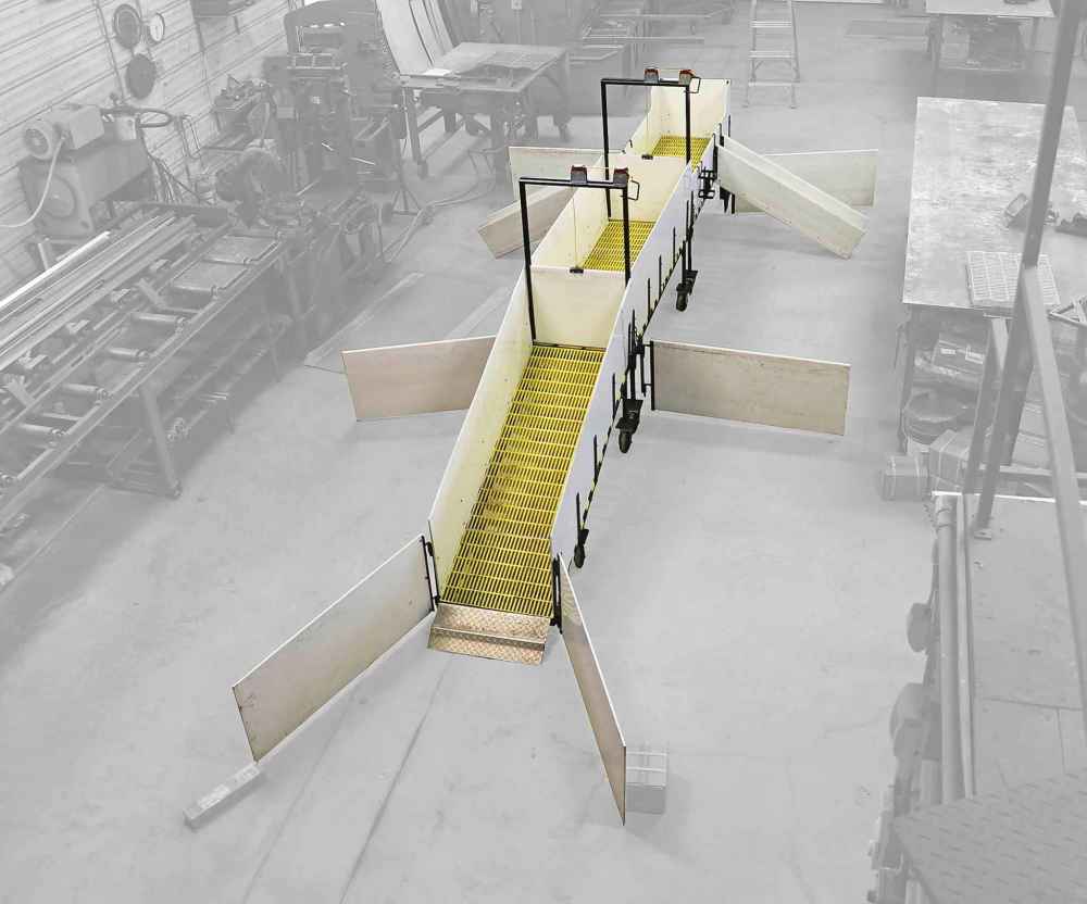 A new ramp at HyLife's pork processing plant in Neepawa has eliminated the need for workers to physically pick up piglets on their way to be vaccinated. (Submitted)