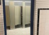 SUPPLIED
                                Photos of the now-doorless washroom show stalls clearly visible from the hallway. A ceiling security camera is mounted just outside the facilities.