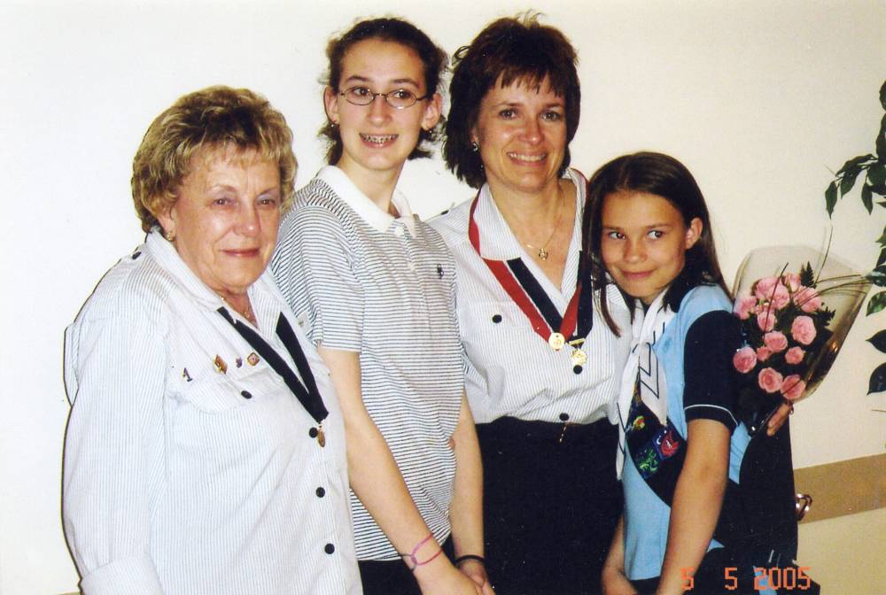 Dorothy Thom (left) with three generations of Girl Guides, including her granddaughter, Allyson, her daughter Sharon, and her granddaughter, Kara. (Supplied)