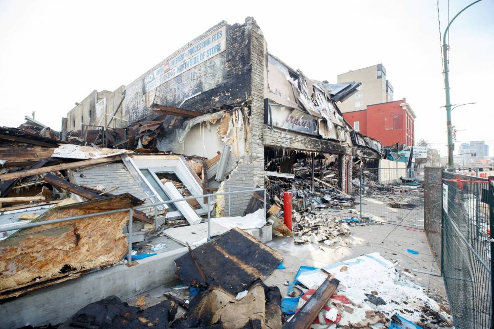 MIKE DEAL / WINNIPEG FREE PRESS
Burned out remains of three businesses in the 800 block of Main Street. The possible arson fire was initially reported at Surplus Direct, a discount retailer, then spread to Top Pro Roofing Ltd. and Lord Selkirk Furniture because the buildings share walls and a roof.