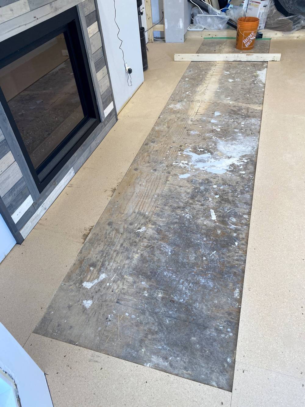 The area being levelled is left unsheathed by pro-board, as the compound is mixed with water and poured in a series of batches.
