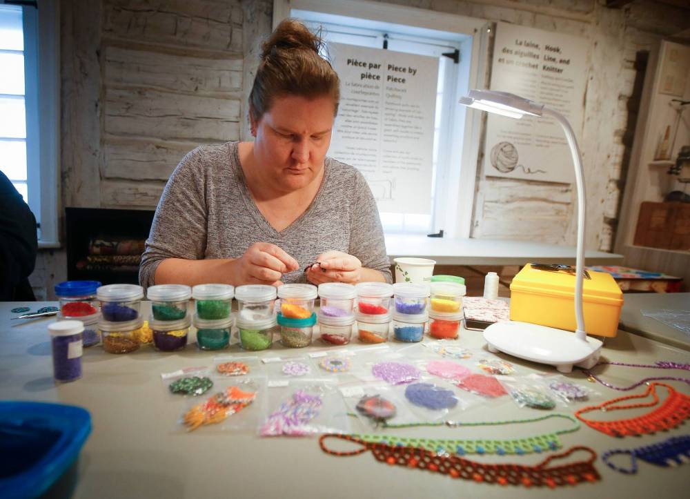 JOHN WOODS / WINNIPEG FREE PRESS
                                Samantha Silvester works on her beading project during the Louis Riel Day celebration at the Saint Boniface Museum.