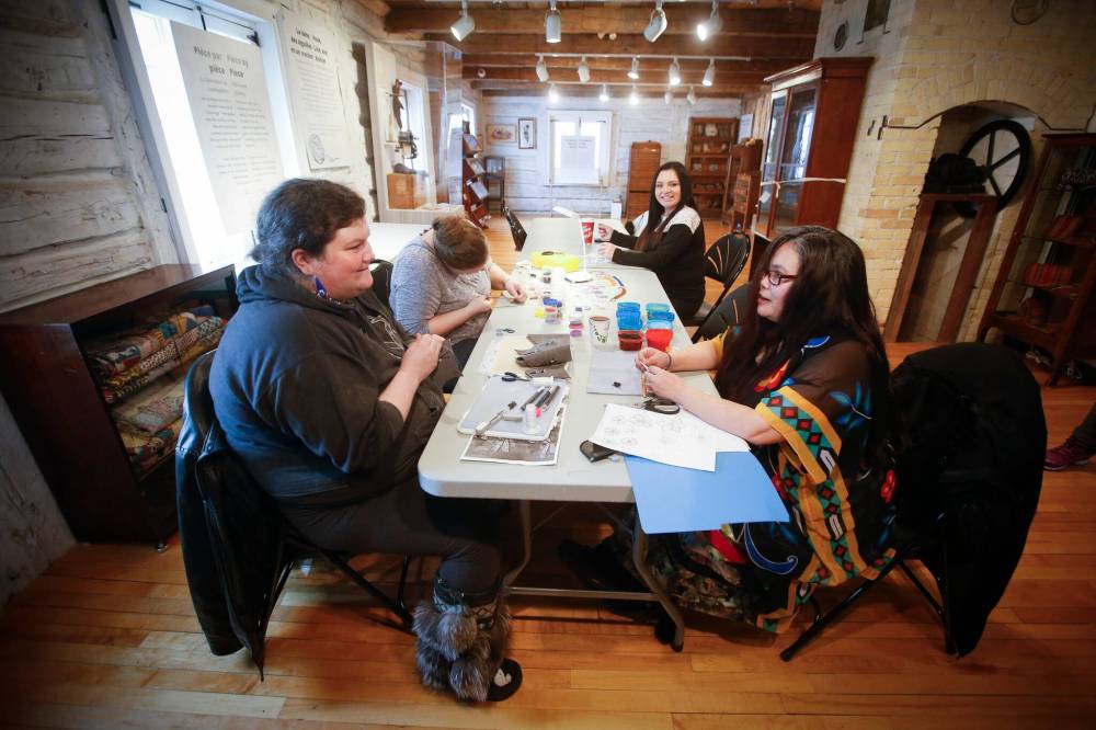 JOHN WOODS / WINNIPEG FREE PRESS
                                Meghan McLeod, from left, Samantha Silvester, Carly Fenner, Cultural Programming Administrative Coordinator at the Louis Riel Institute and Melanie Richard work on their beading projects during the Louis Riel Day celebration at the Saint Boniface Museum in Winnipeg, Monday.