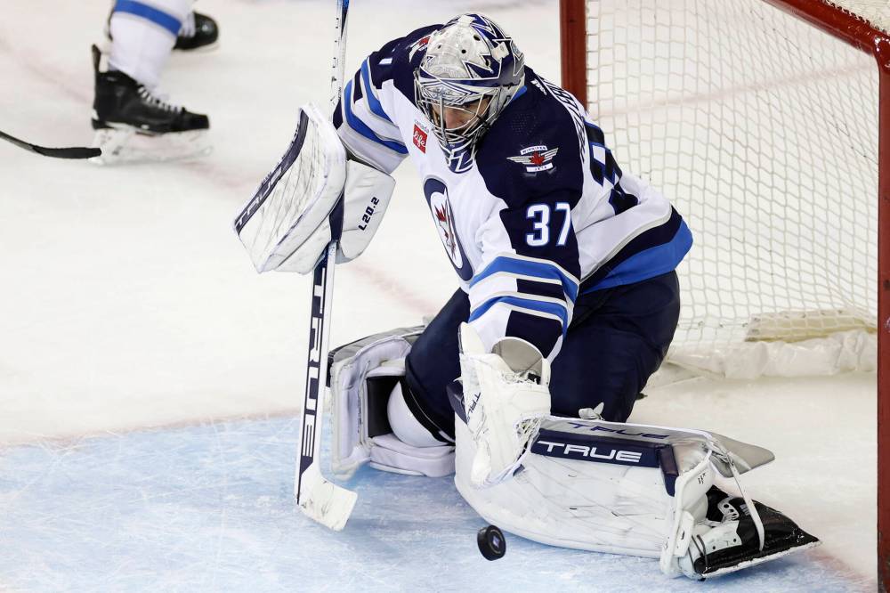 Analytics provided by Sportslogiq indicate Connor Hellebuyck denied 4.87 expected goals, which is the second most by any netminder this year. (Adam Hunger / The Associated Press)