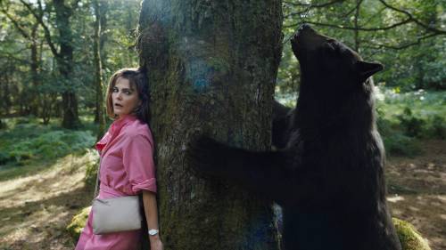 Pat Redmond / Universal Pictures 
                                Keri Russell hides from an apex predator in a scene from Cocaine Bear, now playing.