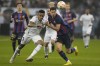 Real Madrid's Eder Militao, left, and Barcelona's Robert Lewandowski fight for possession during the final of the Spanish Super Cup between Barcelona and Real Madrid in Riyadh, Saudi Arabia, Sunday, Jan. 16, 2023. (AP Photo/Hussein Malla)