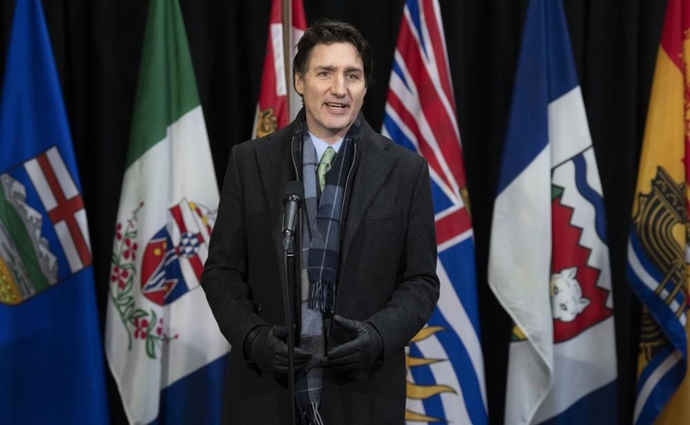 Prime Minister Justin Trudeau speaks with media as he arrives for a health care meeting with premiers, Tuesday, Feb. 7, 2023, in Ottawa. THE CANADIAN PRESS/Adrian Wyld