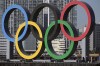 FILE - In this Dec. 1, 2020, file photo, the Olympic rings are reinstalled after it was taken down for maintenance ahead of the postponed Tokyo 2020 Olympics in the Odaiba section in Tokyo. A senior official with the Tokyo Olympic organizing committee and three company executives were arrested Wednesday, Feb. 8, 2023, in an ongoing bid-rigging scandal related to the Games. (AP Photo/Eugene Hoshiko, File)