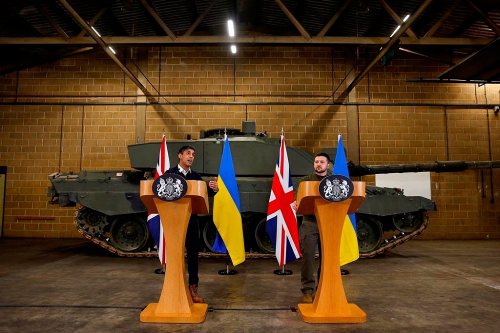 British Prime Minister Rishi Sunak and Ukrainian President Volodymyr Zelenskyy hold a news conference at a military facility in Lulworth, Dorset, England, Wednesday Feb. 8, 2023. (Peter Nicholls/Pool via AP)