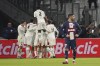Marseille's Alexis Sanchez, covered by his teammates, celebrates after scoring his side's opening goal during the French Cup soccer match between Olympique de Marseille and Paris Saint Germain at the Velodrome stadium in Marseille, southern France, Wednesday, Feb. 8, 2023. (AP Photo/Laurent Cipriani)