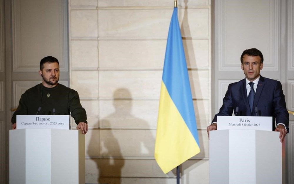 French President Emmanuel Macron, and, and Ukrainian President Volodymyr Zelenskyy attend a joint press conferencewith German Chancellor Olaf Scholz, at the Elysee Palace, Wednesday, Feb. 8, 2023 in Paris. Ukrainian President Volodymyr Zelenskyy sought Western support for his country in surprise visits to Britain and France on Wednesday, pushing for fighter jets to battle Russian invaders in a dramatic speech to the U.K. Parliament, and then flying to Paris to meet the French and German leaders over dinner at the Elysee Palace. (Sarah Meyssonnier, Pool via AP)