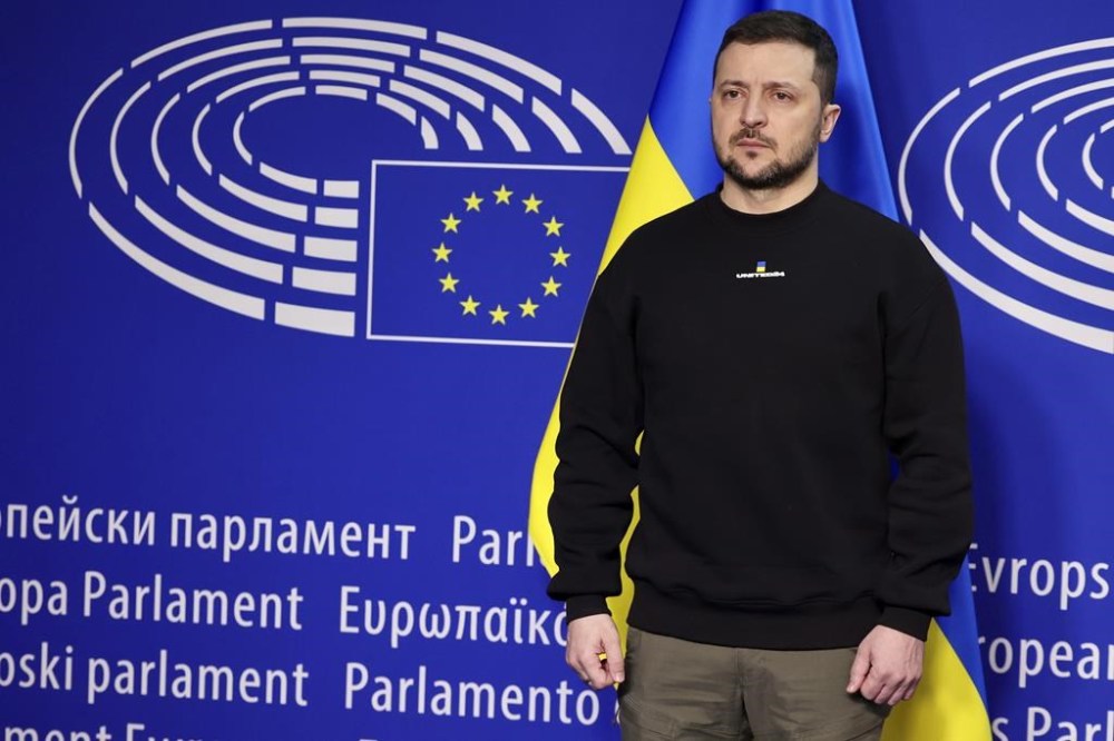 Ukraine's President Volodymyr Zelenskyy poses for a picture before an EU summit at the European Parliament in Brussels, Belgium, Thursday, Feb. 9, 2023. On Thursday, Zelenskyy will join EU leaders at a summit in Brussels, which German Chancellor Olaf Scholz described as a