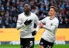 Frankfurt's goal scorer Randal Kolo Muani, left, and Jesper Lindstrom celebrate after scoring the opening goal during a German Bundesliga soccer match between Eintracht Frankfurt and Hertha BSC Berlin in Frankfurt, Germany, Saturday, Feb.4, 2023. (Arne Dedert/dpa via AP)