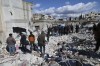 People search through the rubble of collapsed buildings where a newborn girl was found in the town of Jinderis, Aleppo province, Syria, Tuesday, Feb. 7, 2023. A Toronto woman has been devastated after she lost seven of her loved ones in Syria when a massive earthquake destroyed their apartment building early Monday morning. THE CANADIAN PRESS/AP-Ghaith Alsayed