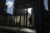 Statistics Canada is set to release its January labour force survey this morning. A man walks though a downtown Toronto office building with other buildings reflected in a window in this June 11, 2019 photo.THE CANADIAN PRESS/Graeme Roy