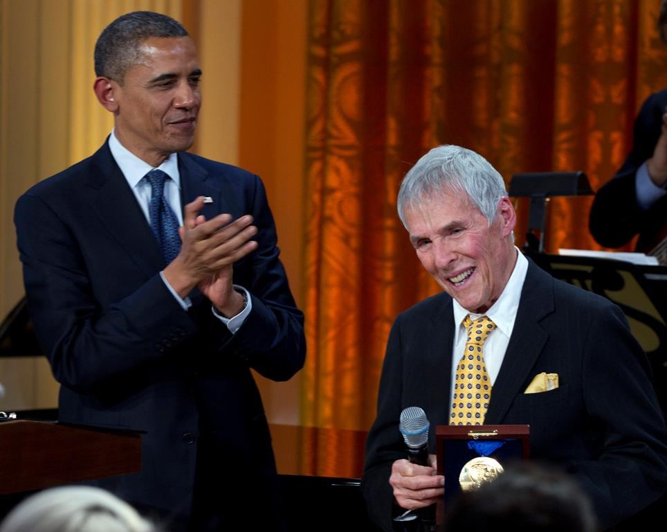 FILE - President Barack Obama applauds after presenting songwriter Burt Bacharach with a 2012 Library of Congress Gershwin Prize for Popular Song in the East Room of the White House on May 9, 2012, in Washington. Bacharach died of natural causes Wednesday, Feb. 8, 2023, at home in Los Angeles, publicist Tina Brausam said Thursday. He was 94. (AP Photo/Carolyn Kaster, File)