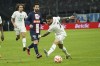 PSG's Lionel Messi, left, challenges for the ball with Marseille's Vitinha during the French Cup soccer match between Olympique de Marseille and Paris Saint Germain at the Velodrome stadium in Marseille, southern France, Wednesday, Feb. 8, 2023. (AP Photo/Laurent Cipriani)