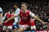 Arsenal's Leandro Trossard celebrates after scoring the opening goal during the English Premier League soccer match between Arsenal and Brentford at Emirates stadium in London, Saturday, Feb. 11, 2023. (AP Photo/Frank Augstein)