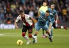Southampton's Carlos Alcaraz, left and Wolverhampton Wanderers' Joao Moutinho battle for the ball, during the English Premier League soccer match between Southampton and Wolverhampton Wanderers, at St. Mary's Stadium, in Southampton, England, Saturday, Feb. 11, 2023. (Kieran Cleeves/PA via AP)