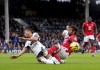 Fulham's Bobby Decordova-Reid, left and Nottingham Forest's Gustavo Scarpa battle for the ball, during the English Premier League soccer match between Fulham and Nottingham Forest at Craven Cottage, London, Saturday, Feb. 11, 2023. (Adam Davy/PA via AP)