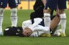 Tottenham's Rodrigo Bentancur receives medical attention during the English Premier League soccer match between Leicester City and Tottenham Hotspur at King Power stadium in Leicester, England, Saturday, Feb. 11, 2023. (AP Photo/Rui Vieira)