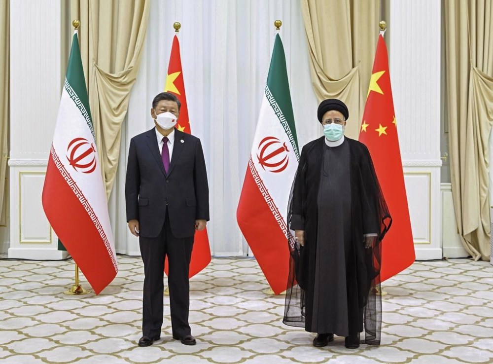 FILE - In this file photo released by China's Xinhua News Agency, Iran's President Ebrahim Raisi, right, and Chinese President Xi Jinping pose for a photo on the sidelines of a meeting at the Shanghai Cooperation Organization (SCO) summit in Samarkand, Uzbekistan on Sept. 16, 2022. Ebrahim Raisi will visit China for a three-day trip on Tuesday, Feb. 14, 2023, at the invitation of Chinese President Xi. (Shen Hong/Xinhua via AP, File)