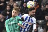 Gladbach's Luca Netz, left, and Hertha's Marco Richter, right, go for a header during the German Bundesliga soccer match between Hetha BSC Berlin and Borussia Moenchengladbach in Berlin, Germany, Sunday, Feb. 12, 2023. (Soeren Stache/dpa via AP)