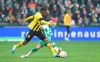 Dortmund's Youssoufa Moukoko, left, and Werder's Leonardo Bittencourt challenge for the ball during the German Bundesliga soccer match between Werder Bremen and Borussia Dortmund in Bremen, Germany, Saturday, Feb. 11, 2023. (Carmen Jaspersen/dpa via AP)
