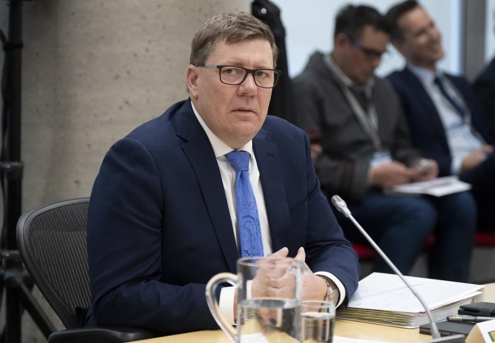 Saskatchewan Premier Scott Moe waits for a health-care meeting to begin with the prime minister, Tuesday, Feb. 7, 2023 in Ottawa. Premier Scott Moe says Ottawa's offer for health-care funding is much lower than what provinces wanted but Saskatchewan will not be turning it down. THE CANADIAN PRESS/Adrian Wyld